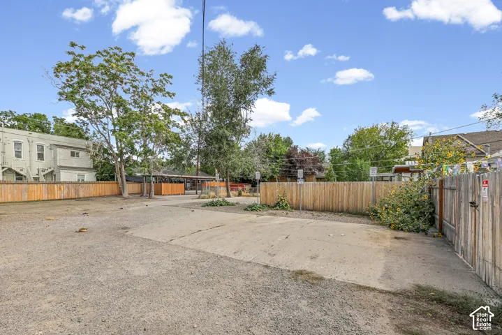 Paved and gravel lot with perimeter fencing