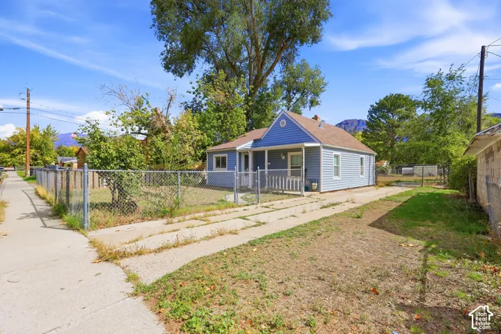 Blue siding exterior with a covered porch