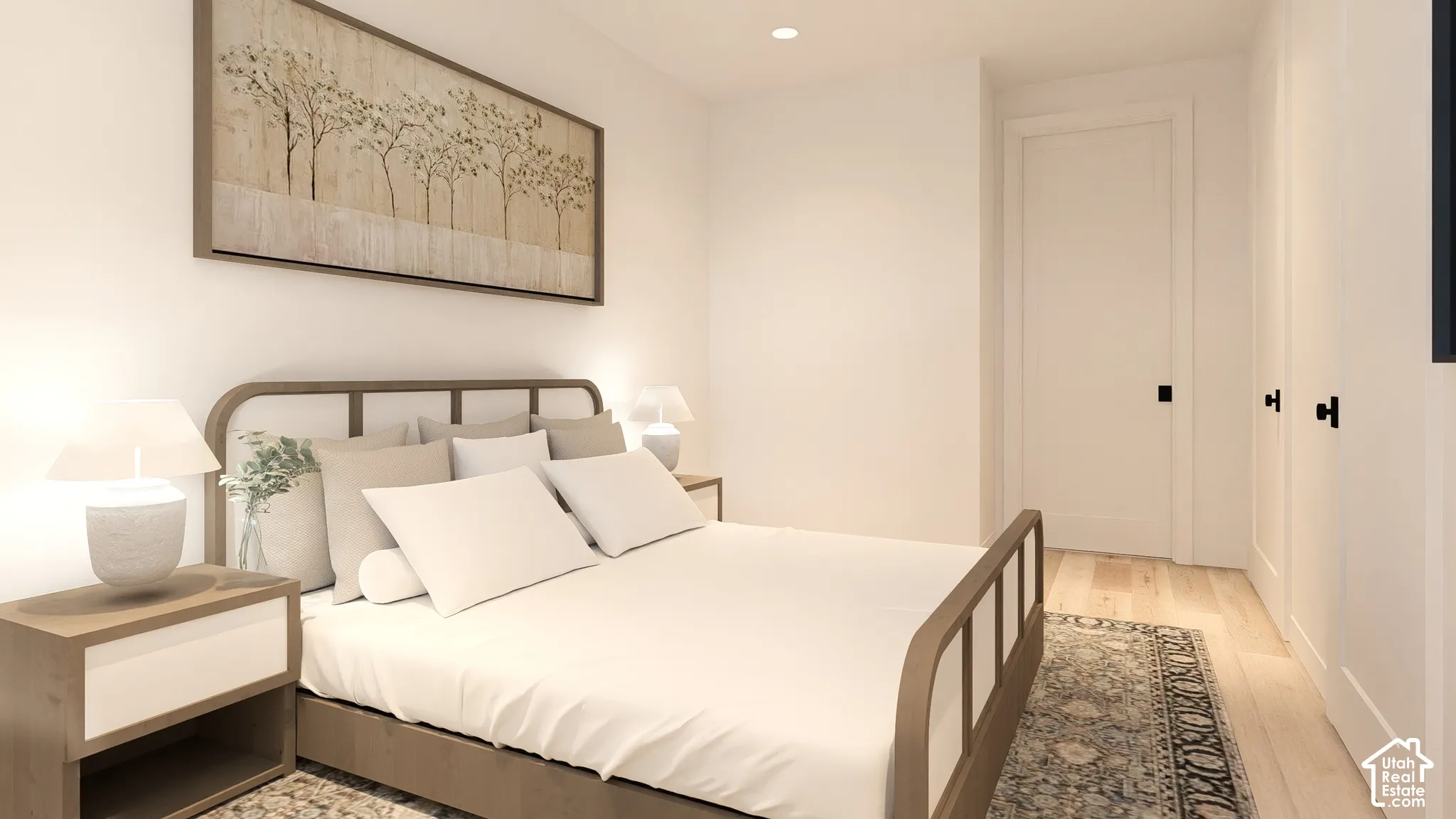 Recessed lighting, light wood-finish flooring, white paneled doors, and matte black hardware