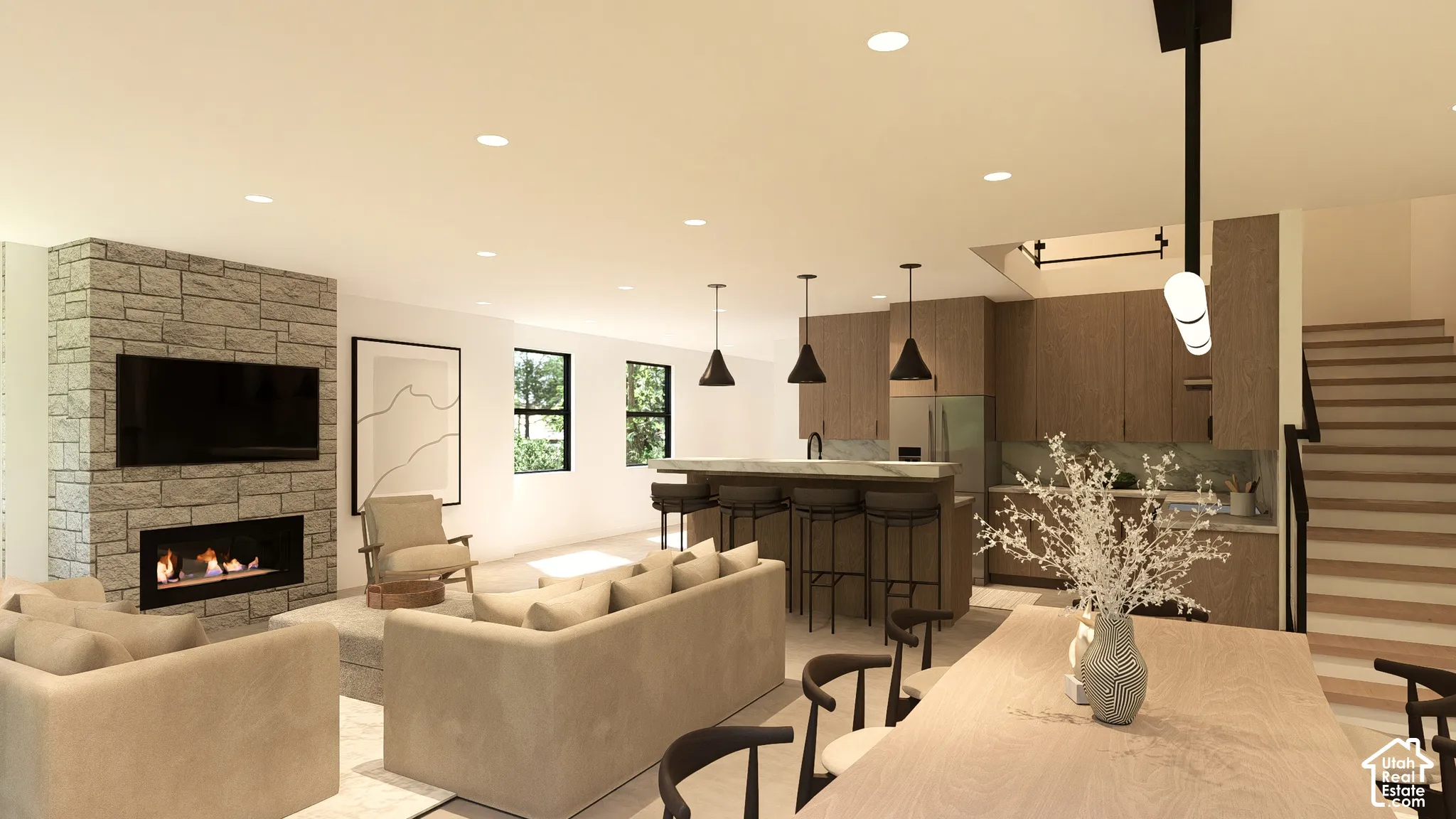 Open-concept living space featuring a stone-clad fireplace, recessed lighting, and large windows