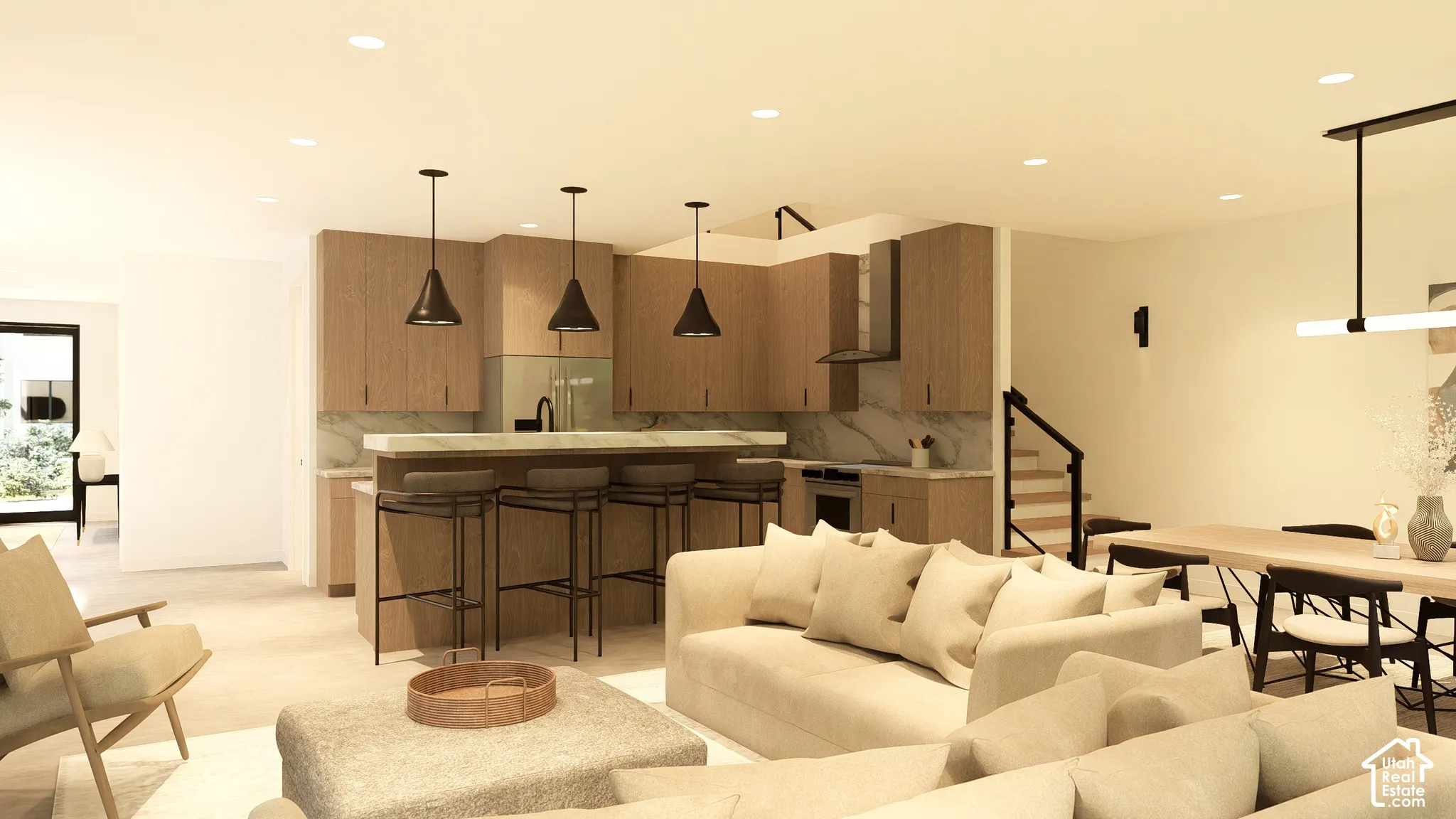 Kitchen featuring wood-finish cabinetry, a large center island with seating, a range hood, and pendant lighting