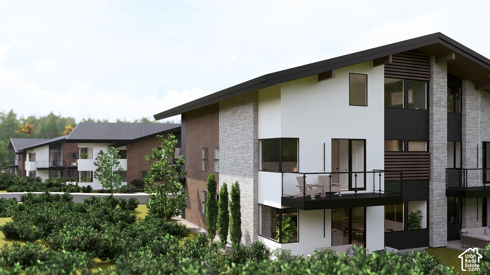 Contemporary architectural design featuring a multi-tone exterior, dark-framed windows, and glass panel balcony railings