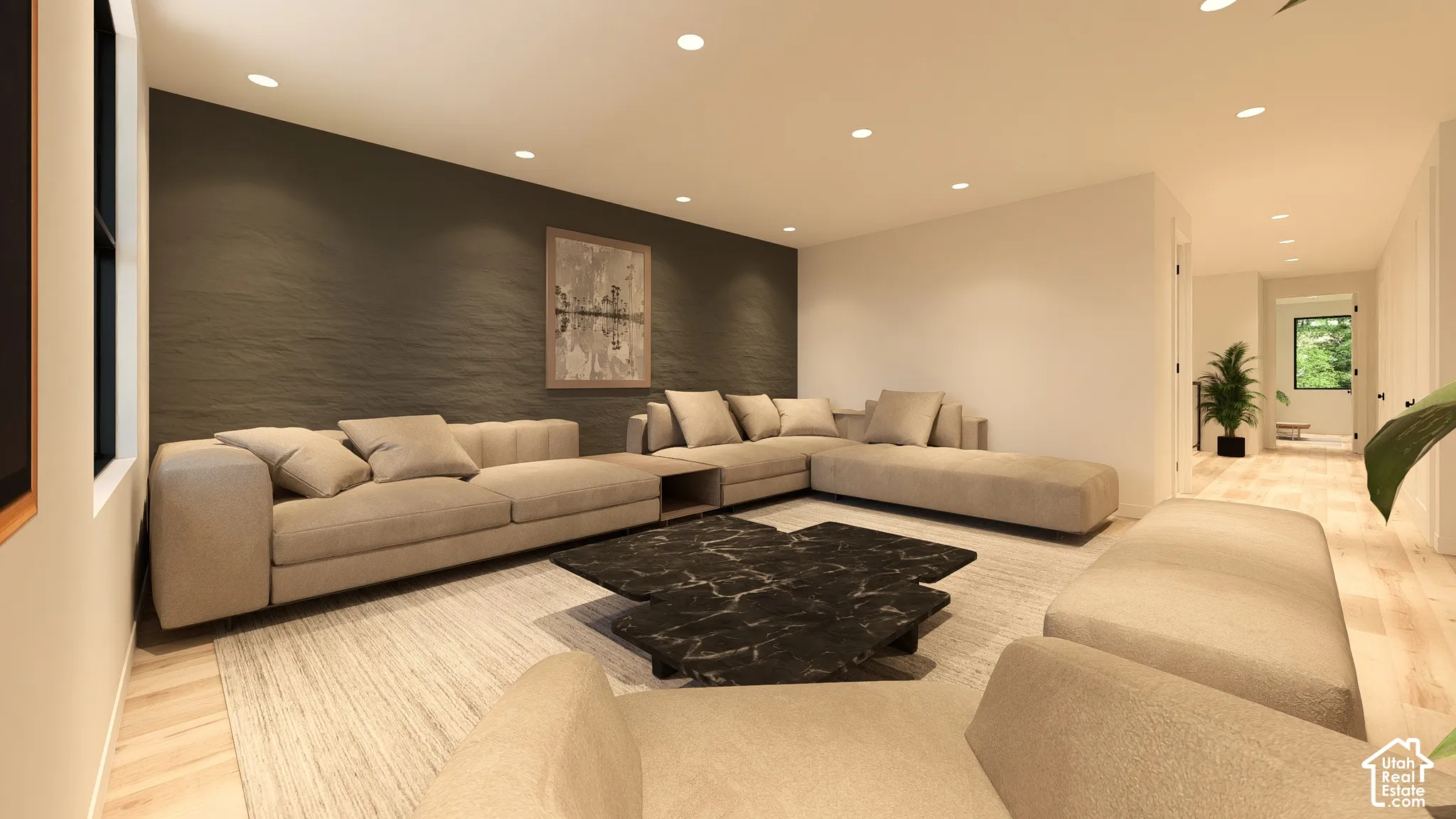 Recessed lighting illuminates the living area with a textured accent wall