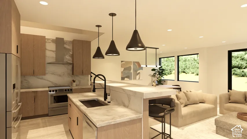 Spacious open-concept living area featuring a kitchen island with integrated sink, stainless steel appliances, wood-finish cabinetry, and large rectangular windows