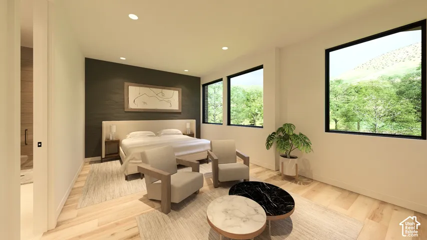 Recessed lighting, light wood-finish flooring, accent wall, multiple windows with black framing, and a large bed with a padded headboard