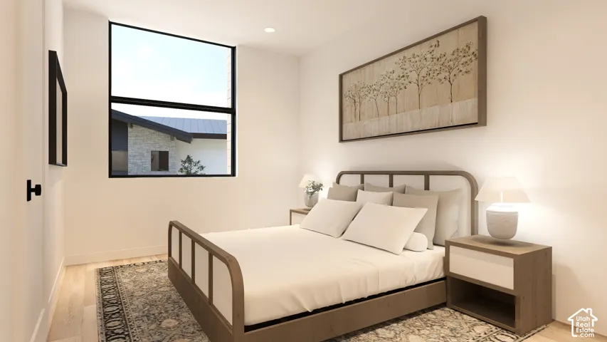 Expansive window with black framing, recessed lighting, and wood-finish flooring