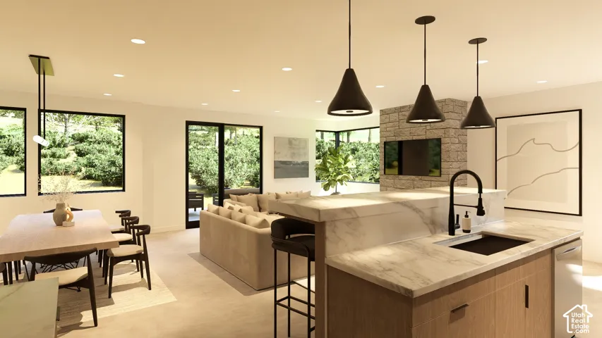 Integrated kitchen island with a stone finish countertop and built-in sink