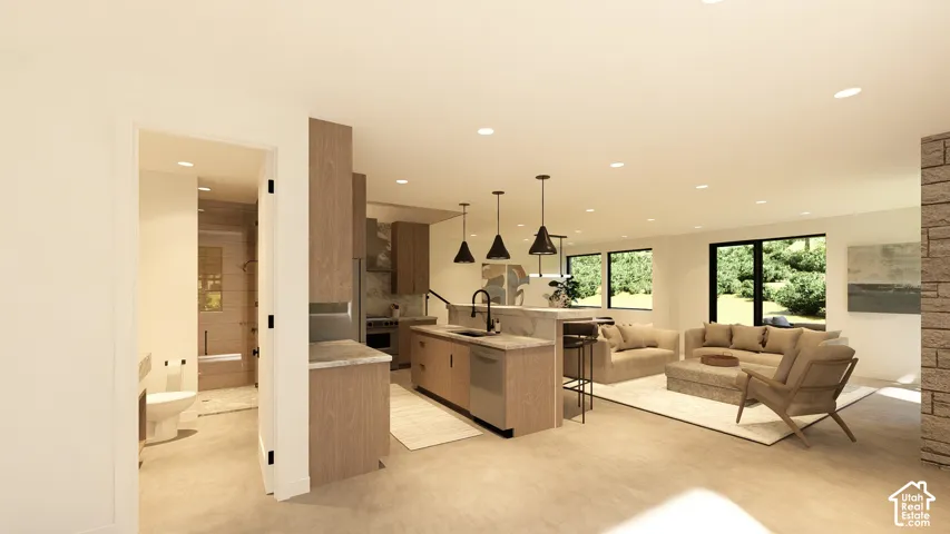 Open concept living area featuring a kitchen island with pendant lighting, a built-in dishwasher, and ample natural light through large windows