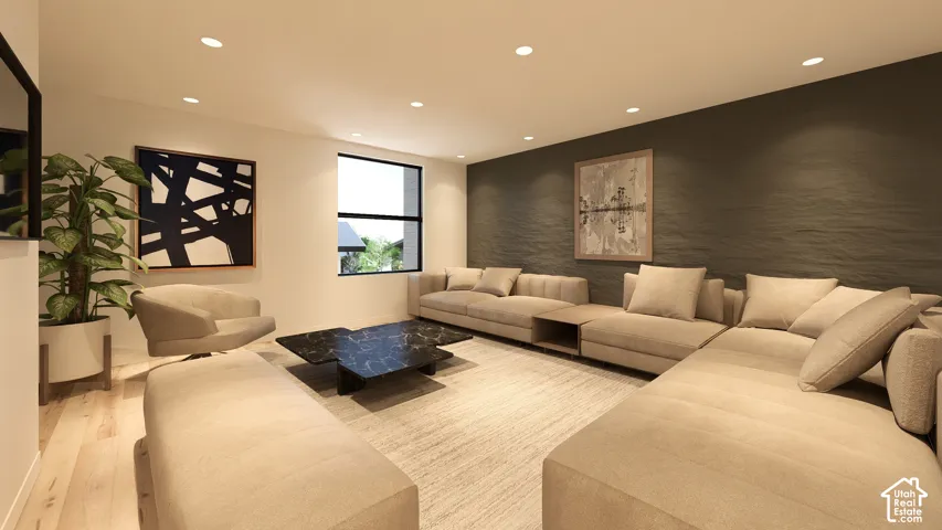 Recessed lighting, light wood-finish flooring, accent wall with textured finish, large window, and built-in shelving
