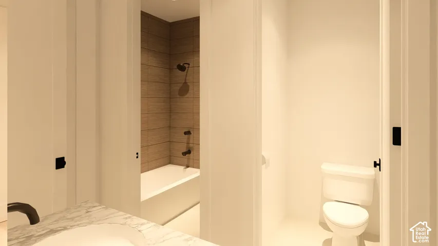 White vanity with a subtle marble-patterned countertop, an undermount sink, and a black faucet