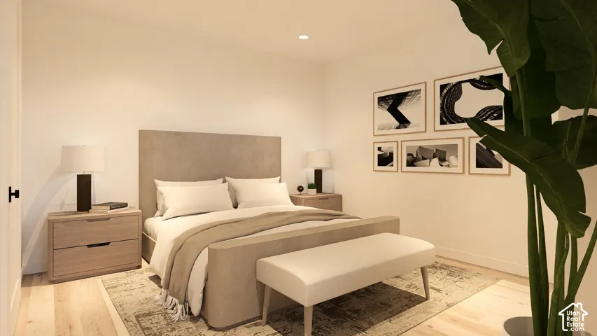Recessed ceiling lighting, light wood-finish flooring, and white painted walls