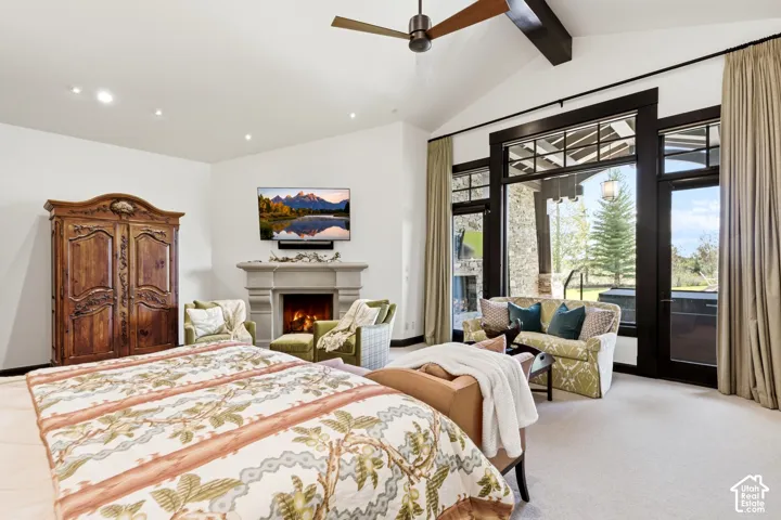 Primary Bedroom with private exterior access to Hot Tub and Fire Setting.