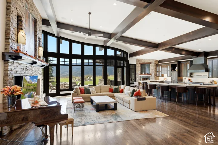 Enormous Great Room with curved glass walls and sophisticated open beam work. An architectural masterpiece!