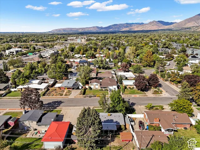 Expansive neighborhood with abundant mature trees and distant mountain ranges