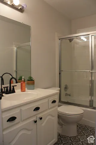 White vanity with black hardware and an integrated sink