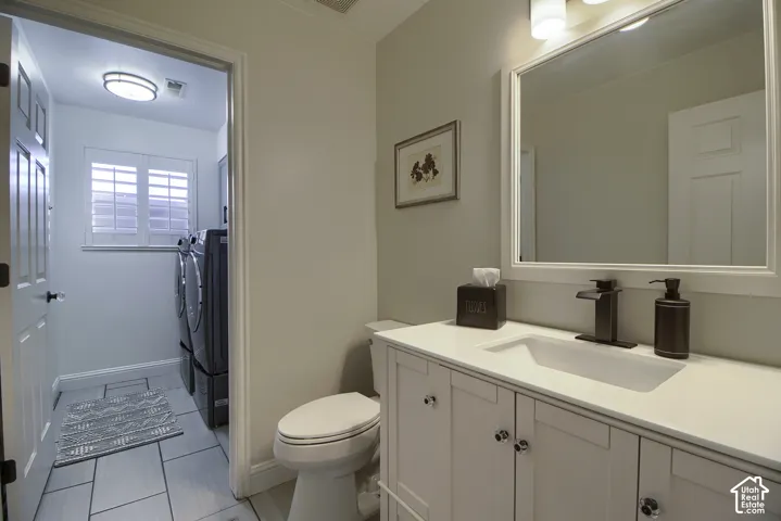 Vanity with integrated sink, bronze-finish faucet, and a framed mirror