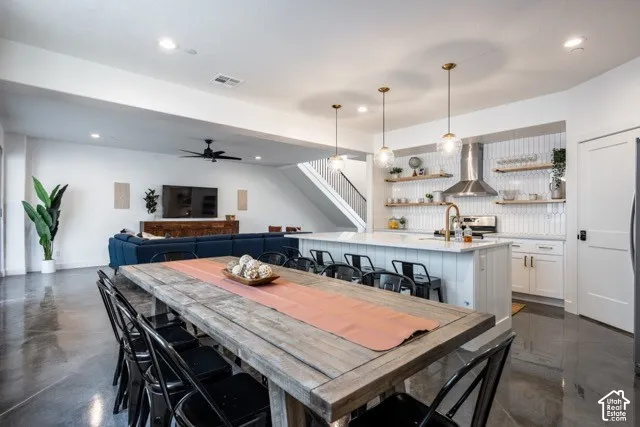 Open-concept living space featuring polished concrete flooring