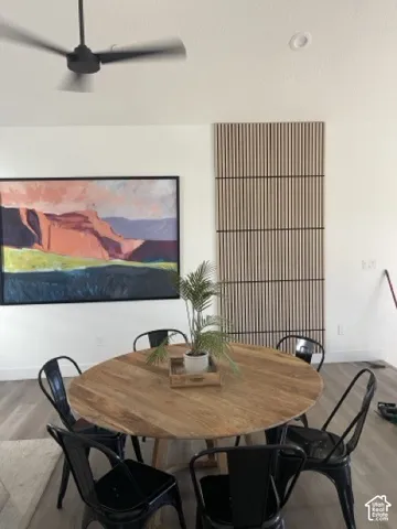 Recessed ceiling lighting, wood-finish flooring, and a ceiling fan