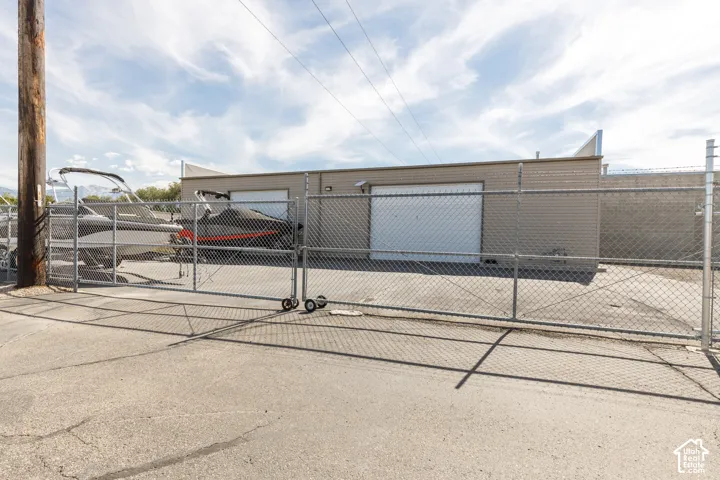 Chain link fencing with gated access and paved lot
