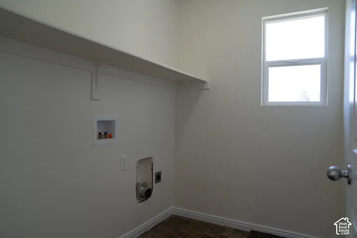 Built-in shelving, laundry hookups, wall-mounted outlets, and a window