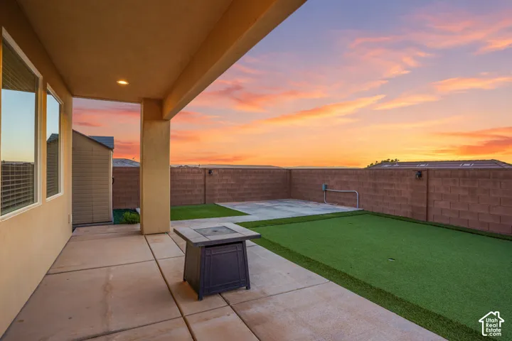 Covered patio with incredible views, putting green, ready for a hot tub.