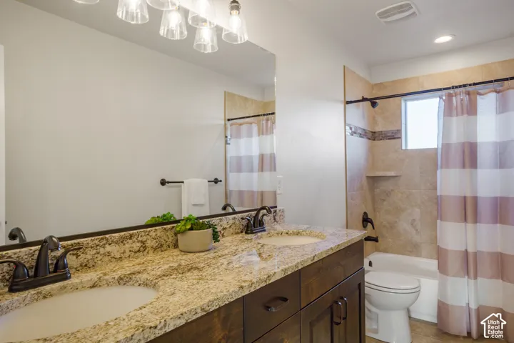 Hall Bathroom. Dual vanity with granite countertop and integrated sinks