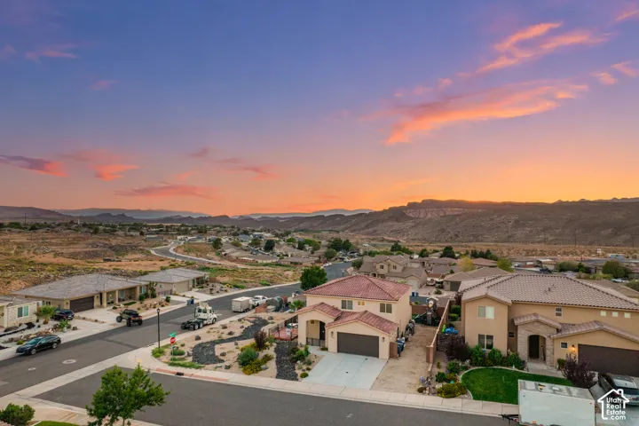 Neighborhood setting with desert landscaping and paved roadways
