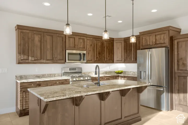 Center island with a single basin sink and gooseneck faucet
