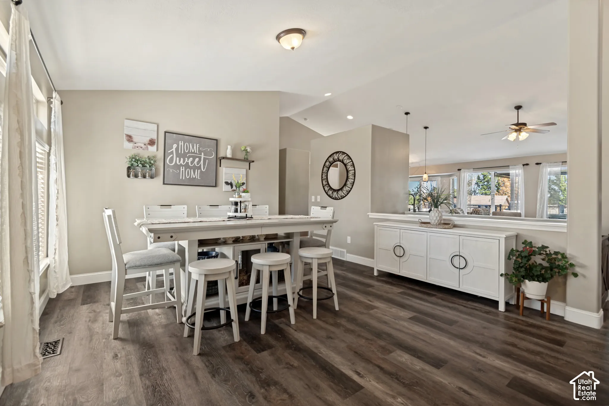 Wood-finish flooring, recessed lighting, and a partial wall with a built-in ledge
