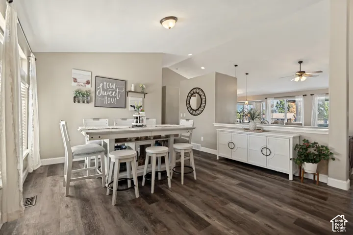 Wood-finish flooring, recessed lighting, and a partial wall with a built-in ledge