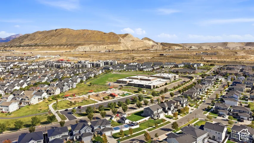 Expansive residential area featuring numerous single-family homes, multi-family residences, and a large recreational green space