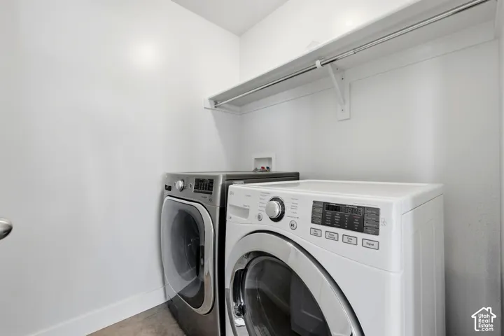 Appliance hookups, built-in shelving, and a hanging rod for laundry