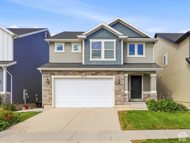 Contemporary two-story exterior with stone and siding accents