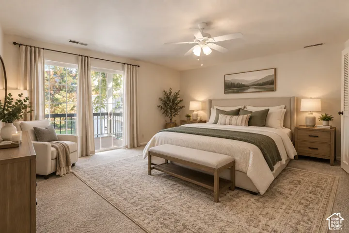 Sliding glass door access to a balcony with black railings, a ceiling fan, and light-toned walls