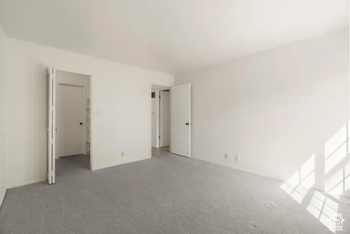 Light gray carpeting with white walls
