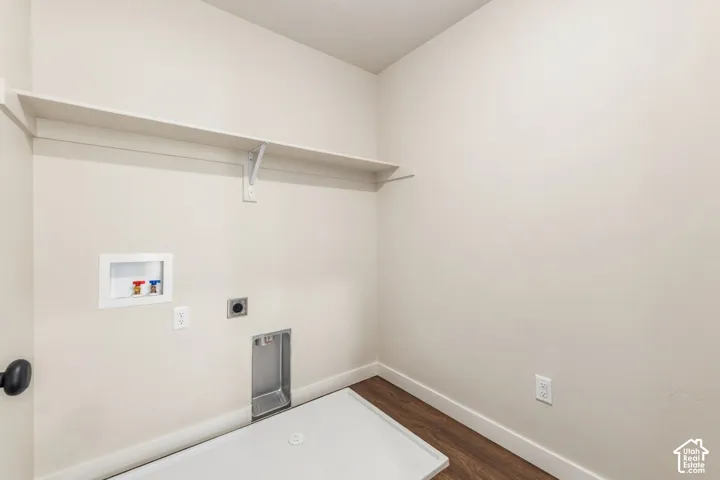 Built-in shelving, wood-finish flooring, and utility hookups
