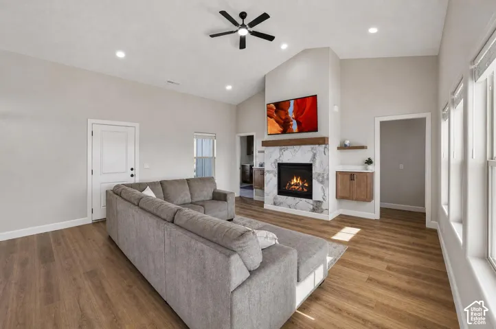 Vaulted ceilings featuring recessed lighting and a ceiling fan