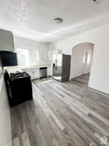 West Kitchen with brand new appliances, and LVP flooring.
