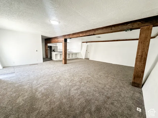 East very large living room with a kitchen.