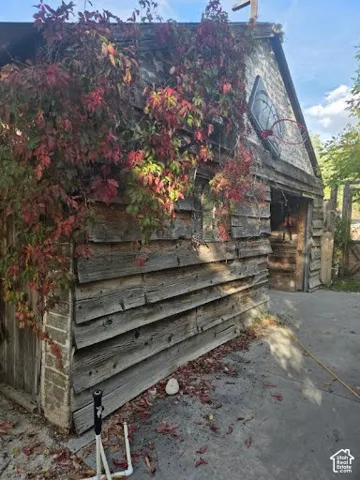 Weathered wood siding with an adjacent concrete pad