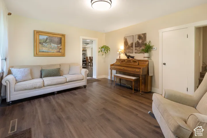 Wood-finish flooring throughout, light-toned wall paint, and white trim