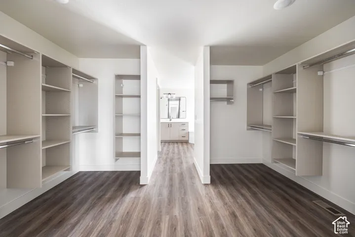 Integrated closet system featuring hanging rods and shelving