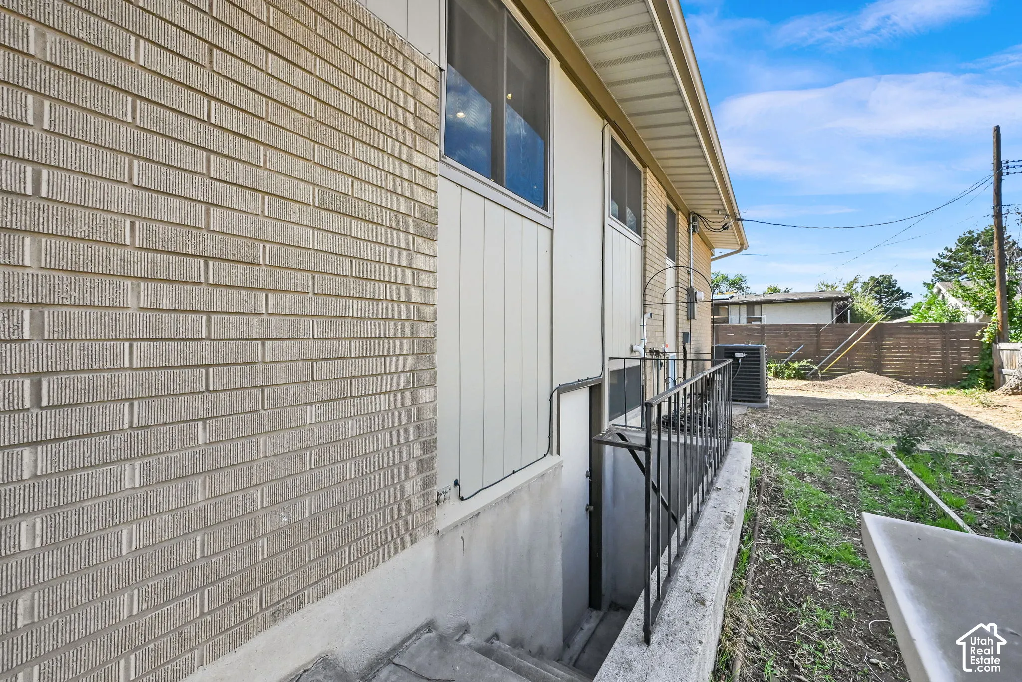 Brick exterior with light-colored siding accents