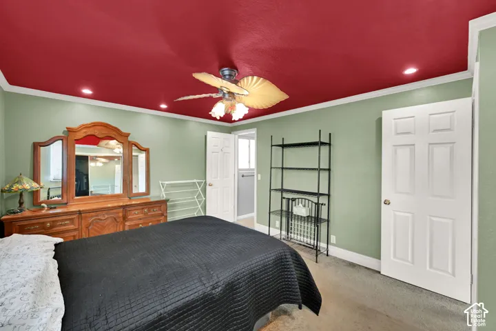 Recessed lighting, ceiling fan fixture, crown molding, and paneled interior door