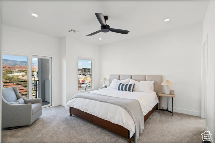 Recessed lighting, ceiling fan, and carpeted flooring