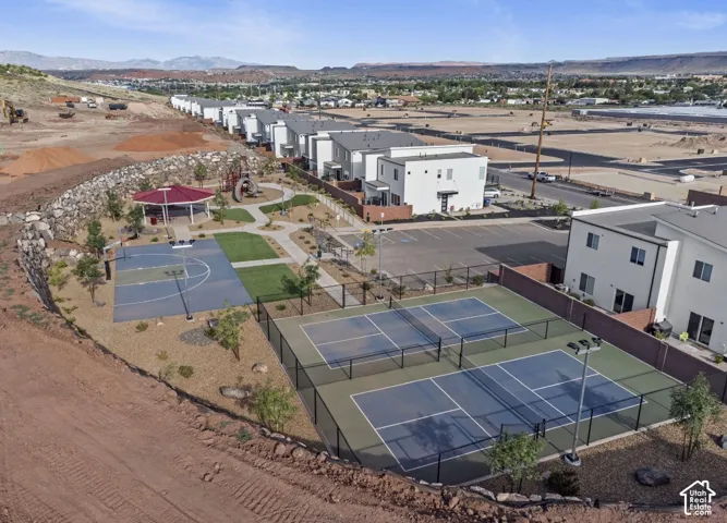 Community amenities include multiple pickleball courts, a basketball court, a shaded gazebo, a playground, and modern residential structures
