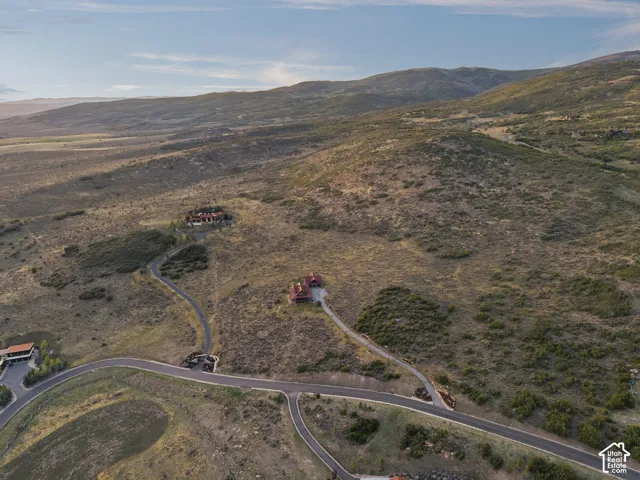 Expansive land offering multiple building sites, paved road access, and mountainous terrain