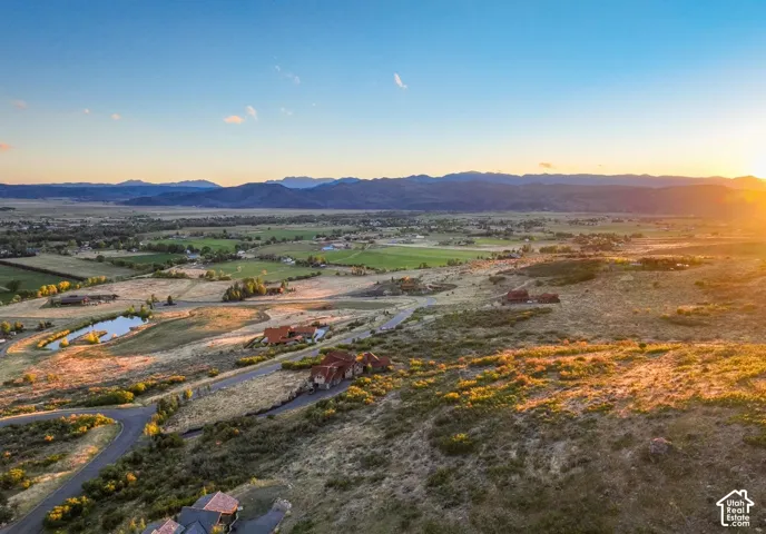 Expansive mountain range backdrop and distant developed areas