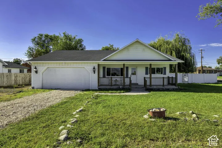 White siding exterior with a dark shingle roof