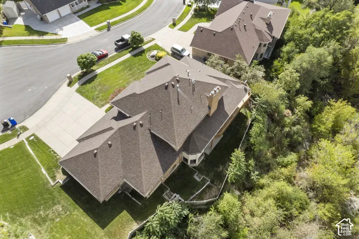 Expansive residential estate featuring a multi-level architectural design with steeply pitched rooflines and multiple gables